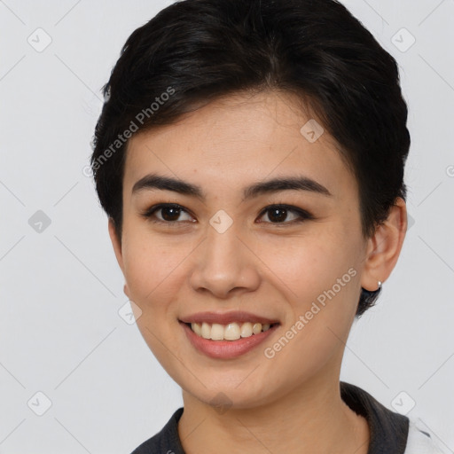 Joyful asian young-adult female with short  brown hair and brown eyes