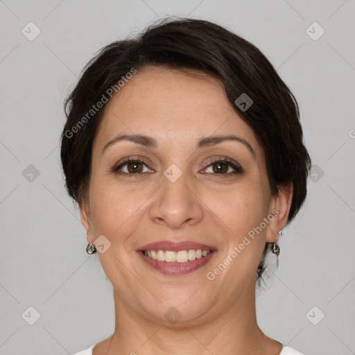 Joyful white adult female with short  brown hair and brown eyes