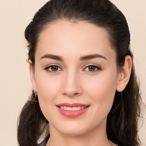 Joyful white young-adult female with long  brown hair and brown eyes