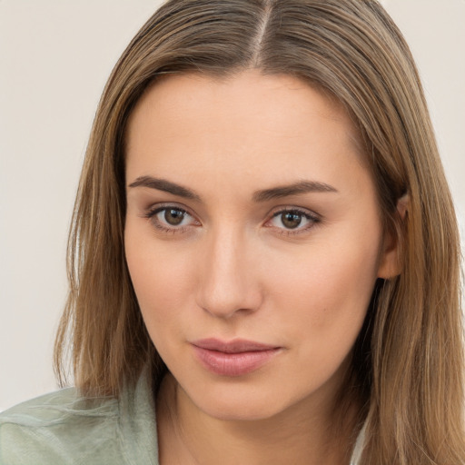 Neutral white young-adult female with long  brown hair and brown eyes