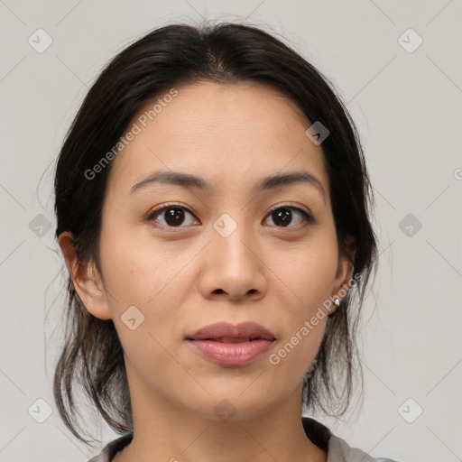 Joyful asian young-adult female with medium  brown hair and brown eyes