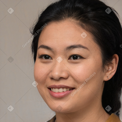 Joyful asian young-adult female with medium  brown hair and brown eyes