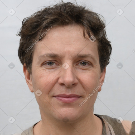 Joyful white adult male with short  brown hair and grey eyes