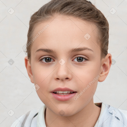 Joyful white child female with short  brown hair and brown eyes