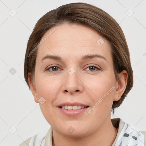 Joyful white young-adult female with medium  brown hair and grey eyes