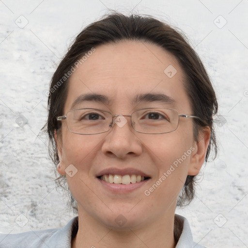 Joyful white adult female with medium  brown hair and brown eyes