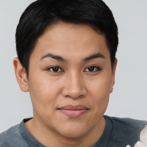 Joyful asian young-adult female with short  brown hair and brown eyes
