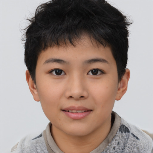 Joyful asian child male with short  brown hair and brown eyes