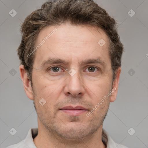 Joyful white adult male with short  brown hair and grey eyes