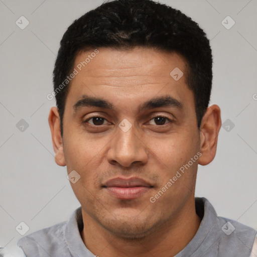 Joyful white young-adult male with short  black hair and brown eyes