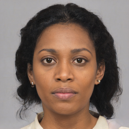 Neutral black young-adult female with medium  black hair and brown eyes