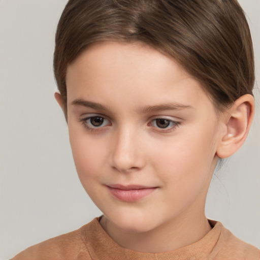 Joyful white child female with short  brown hair and brown eyes