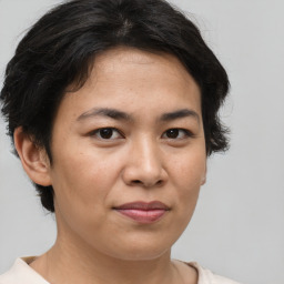 Joyful asian young-adult female with short  brown hair and brown eyes