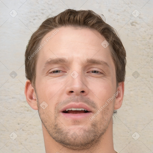 Joyful white adult male with short  brown hair and grey eyes