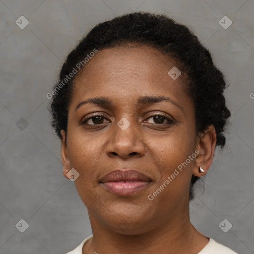 Joyful black adult female with short  brown hair and brown eyes