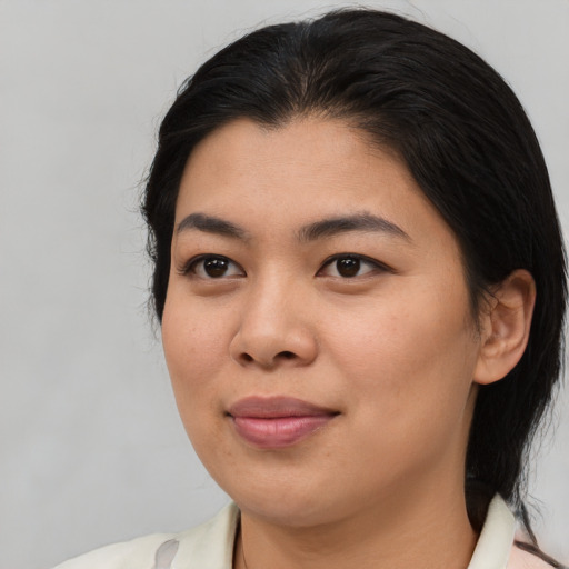 Joyful asian young-adult female with medium  brown hair and brown eyes