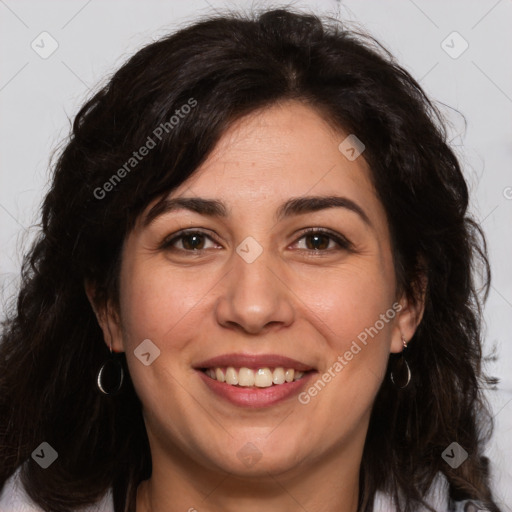 Joyful white adult female with long  brown hair and brown eyes