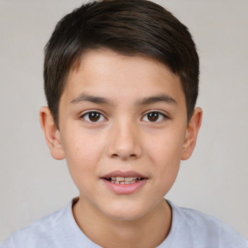 Joyful white child male with short  brown hair and brown eyes