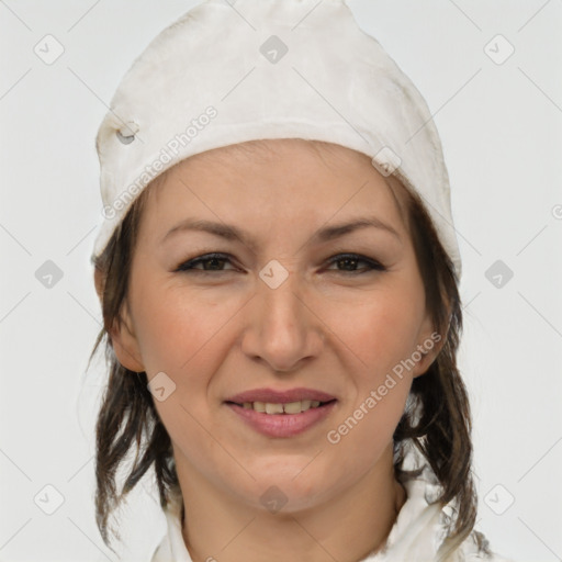 Joyful white adult female with medium  brown hair and grey eyes