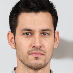 Neutral white young-adult male with short  brown hair and brown eyes