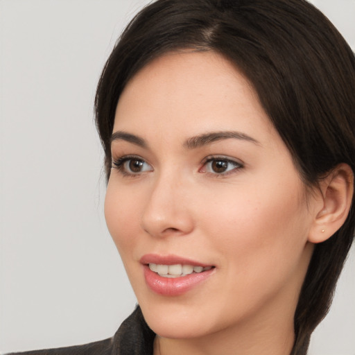 Joyful white young-adult female with medium  brown hair and brown eyes