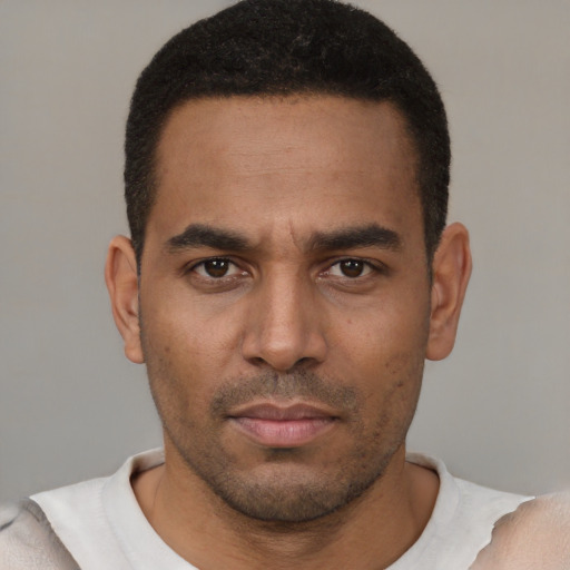 Neutral latino young-adult male with short  black hair and brown eyes