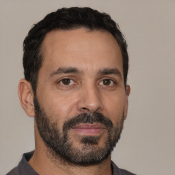 Neutral white adult male with short  black hair and brown eyes