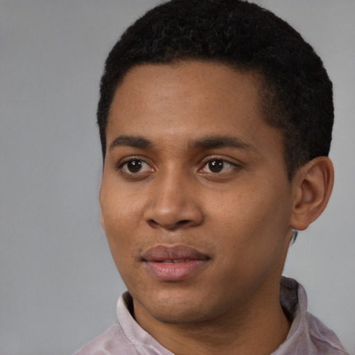 Joyful black young-adult male with short  black hair and brown eyes