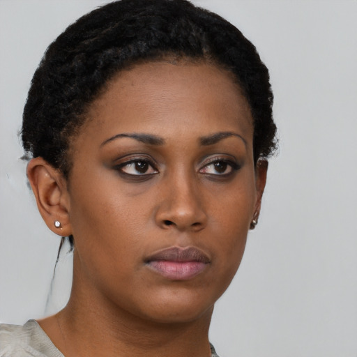 Neutral black young-adult female with short  brown hair and brown eyes