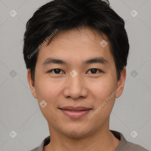 Joyful asian young-adult male with short  black hair and brown eyes