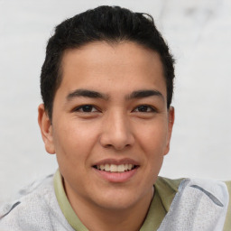 Joyful latino young-adult male with short  brown hair and brown eyes