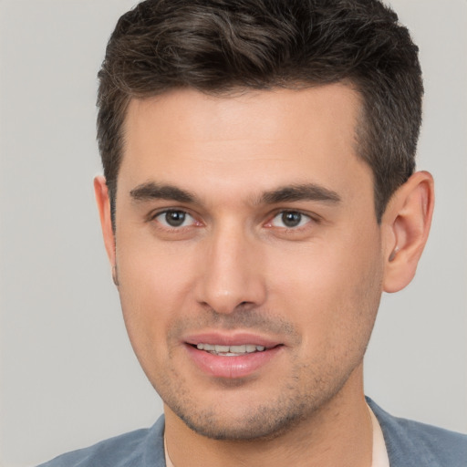 Joyful white young-adult male with short  brown hair and brown eyes