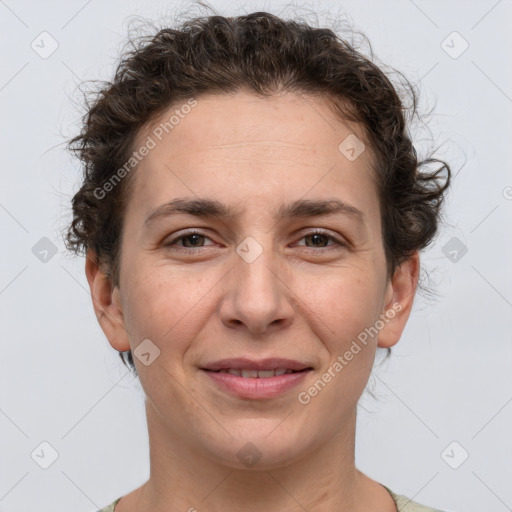 Joyful white adult female with short  brown hair and brown eyes