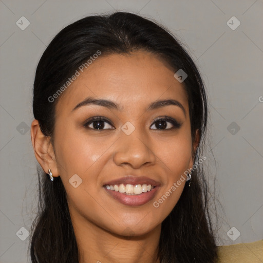 Joyful latino young-adult female with long  brown hair and brown eyes