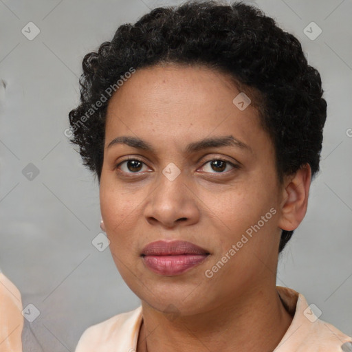 Joyful black adult female with short  brown hair and brown eyes