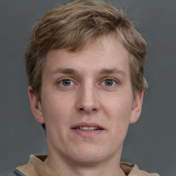 Joyful white adult male with short  brown hair and grey eyes