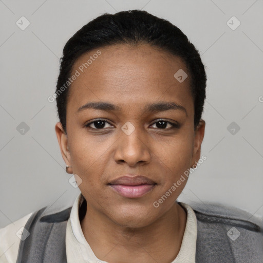 Joyful black young-adult female with short  black hair and brown eyes