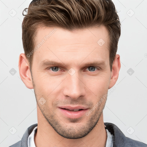 Joyful white young-adult male with short  brown hair and grey eyes