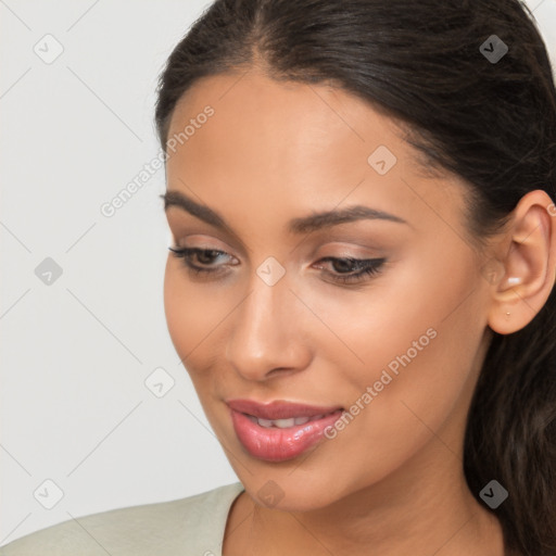 Joyful latino young-adult female with long  brown hair and brown eyes