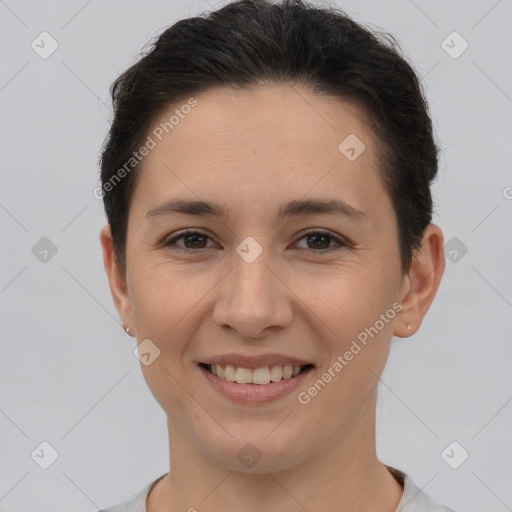 Joyful white young-adult female with short  brown hair and brown eyes