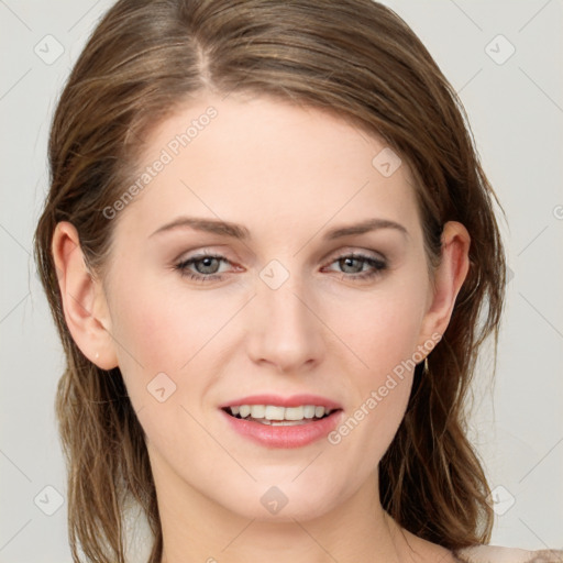 Joyful white young-adult female with long  brown hair and blue eyes