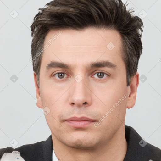 Neutral white young-adult male with short  brown hair and brown eyes