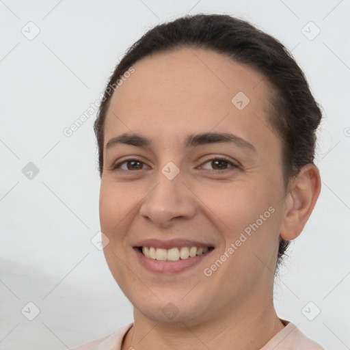 Joyful white young-adult female with short  brown hair and brown eyes