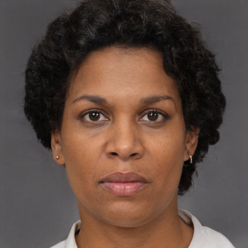 Neutral black adult female with short  brown hair and brown eyes