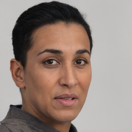 Neutral latino adult female with short  brown hair and brown eyes