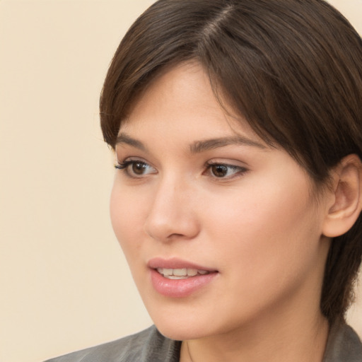 Neutral white young-adult female with medium  brown hair and brown eyes