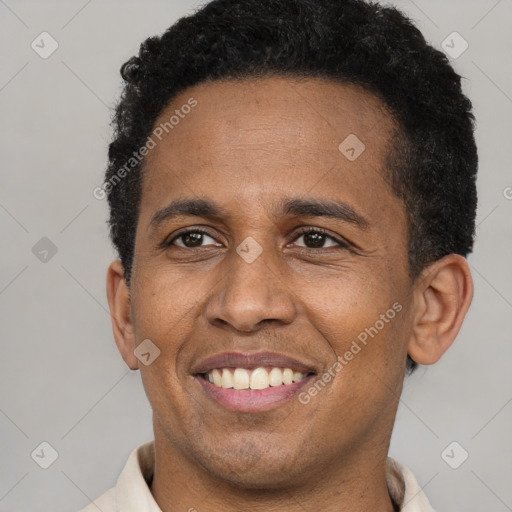 Joyful latino adult male with short  black hair and brown eyes