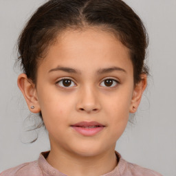 Joyful white child female with short  brown hair and brown eyes