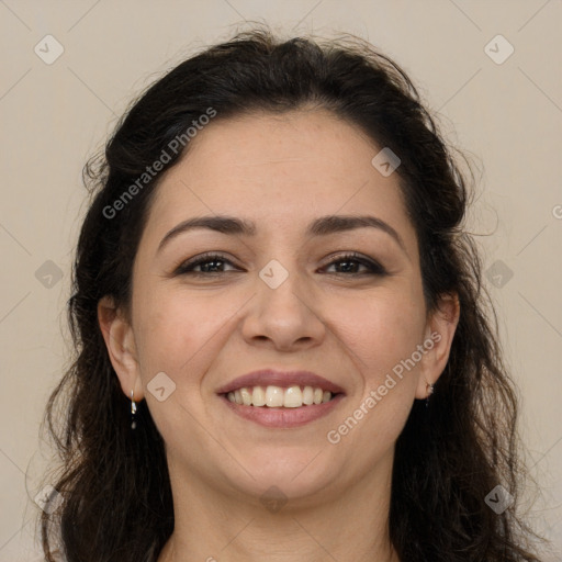 Joyful white adult female with long  brown hair and brown eyes