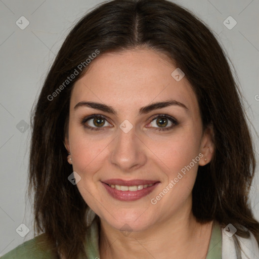 Joyful white young-adult female with medium  brown hair and green eyes